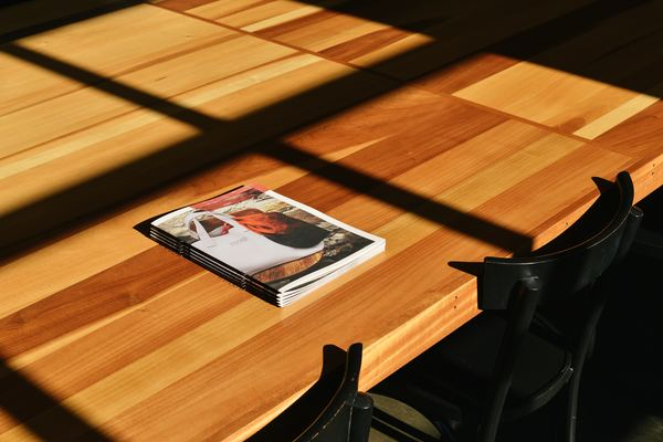 White Book on Brown Wooden Table · Free Stock Photo