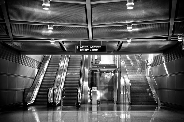 urban,transportation system,subway system,stairs,staircase,reflection,modern,escalator,elevator,ceiling,black-and-white,architecture,airport