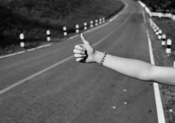 arm,gesture,hand,help,highway,hitchhike,ride,road,sign,symbol,thumb,transportation,travel,waiting