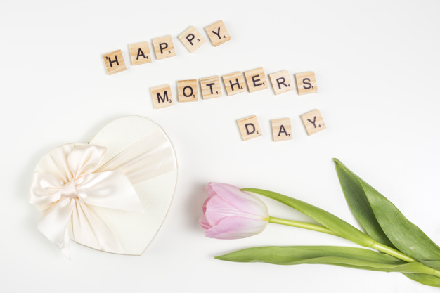 lay,arrangement,inscription,phrase,composition,bloom,horizontal,flat lay,petal,mothers,greeting,top view,top,day,decor,bright,beautiful,view,tulip,blossom,fresh,word,happy mothers day,wooden,message,package,natural,decoration,plant,flat,present,shape,white,letter,event,holiday,colorful,text,bow,happy,white background,celebration,spring,cute,gift box,pink,table,box,green,leaf,gift,design,heart,floral,ribbon,flower,background
