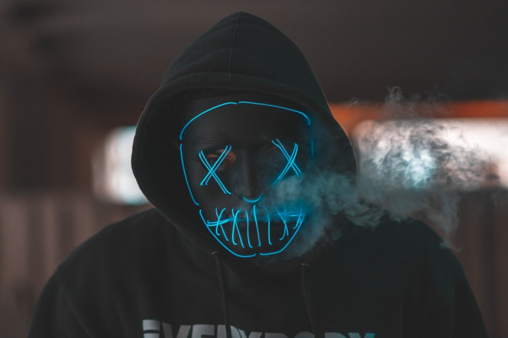 Person in Black Hoodie with Mask · Free Stock Photo