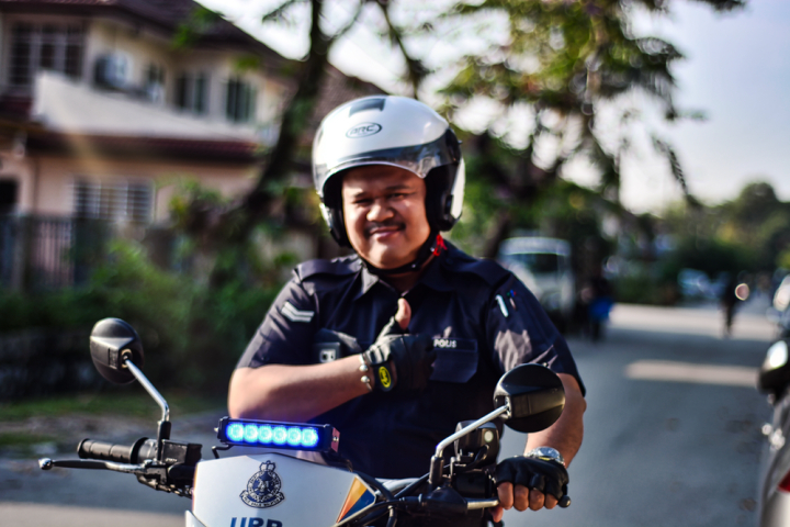 adult,biker,blur,bokeh,depth of field,face,facial expression,focus,gesture,guy,happiness,happy,headwear,helmet,led,light,man,motor,motorbike,motorcycle,rider,riding,smile,smiling,thumbs up,transportation system,vehicle,wear