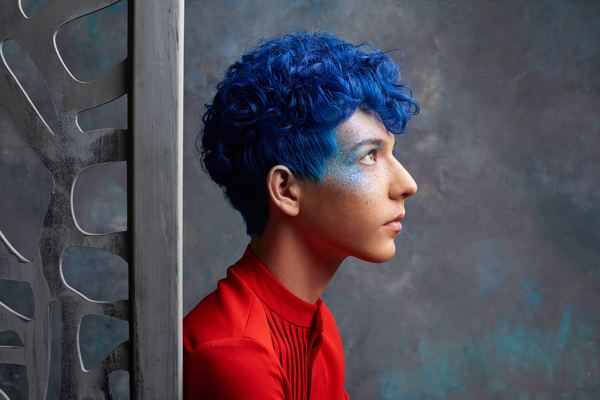 Free: blue-haired man wearing red top 