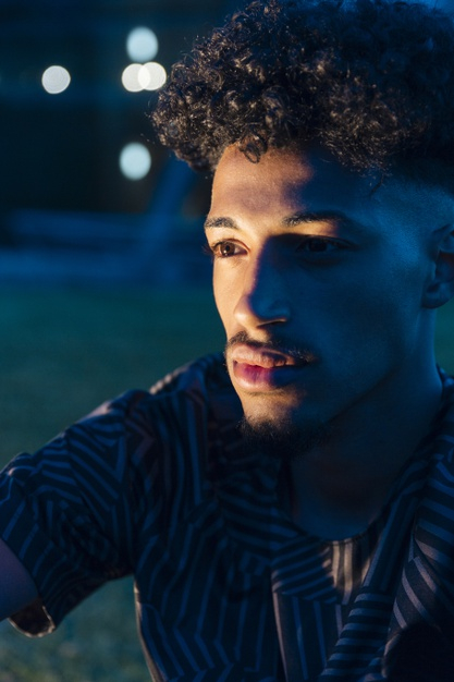 looking away,unsmiling,unemotional,openspace,pensive,gaze,youngster,focused,away,thoughtful,dusk,twilight,serious,darkness,upset,confident,handsome,african american,evening,relaxing,dreaming,outdoors,crop,looking,calm,blurred,haircut,male,american,blurred background,teen,portrait,hairstyle,african,beard,ethnic,bokeh,night,person,black,man,light,background