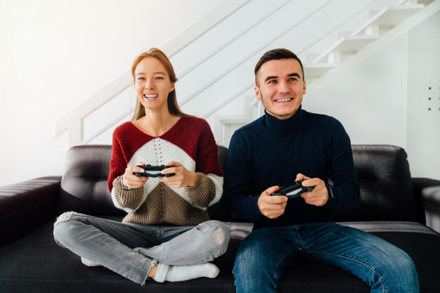 people,technology,house,man,home,smile,happy,couple,friends,video,interior,fun,games,online,play,video game,female,together,beautiful,sitting