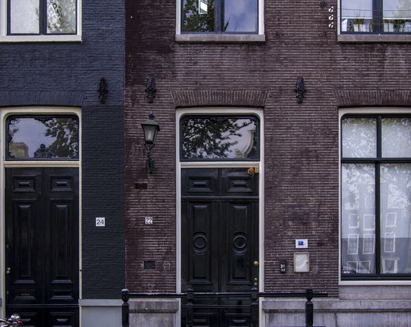 amsterdam,city,building,sea,rock,cloud,energy,building,architecture,house,facade,home exterior,door,architecture,brick,city living,window,side,home,entrance,number
