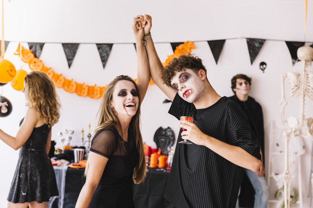 party,halloween,camera,hands,red,autumn,orange,black,couple,decoration,glass,drink,fall,blood,balloons,teenager,pumpkin,date,zombie,young