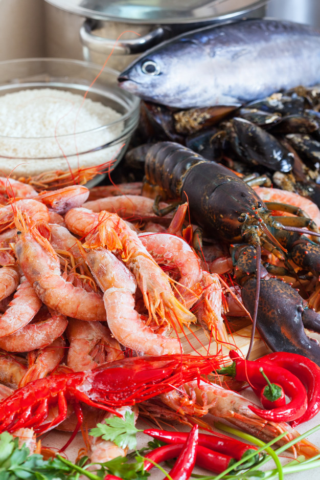 uncooked,specialties,sea foods,nobody,seafoods,clams,mackerel,still life,still,prawns,mariscos,domestic,raw,shellfish,paella,ingredient,nutricion,prawn,spanish,european,delicious,lobster,sea food,foods,gourmet,spain,pan,shrimp,marine,fresh,shell,pot,nutrition,healthy food,life,seafood,healthy,product,cooking,rice,cook,table,kitchen,fish,sea,food