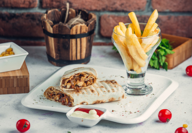 durum,lavash,armenian,grilled,tortilla,burrito,appetizer,doner,pita,shawarma,wrap,cuisine,turkish,lettuce,fastfood,fries,french,meal,kebab,pepper,snack,beef,greek,fresh,dish,traditional,lunch,tomato,roll,wooden,salad,sandwich,dinner,vegetable,plate,meat,bread,board,arabic,vegetables,chicken,food