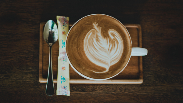cappuccino,sugar,mug,coffee,drink,cream,cup,foam,art,saucer,spoon,still life,wood,breakfast