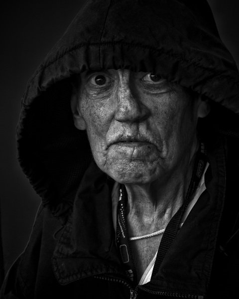 wear,sadness,portrait,person,man,male,human,facial expression,face,eyes,elderly,elder,dark,black and white,adult