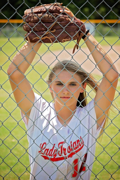 young,woman,wire mesh,sport,softball,player,model,glove,girl,fence,female,athlete