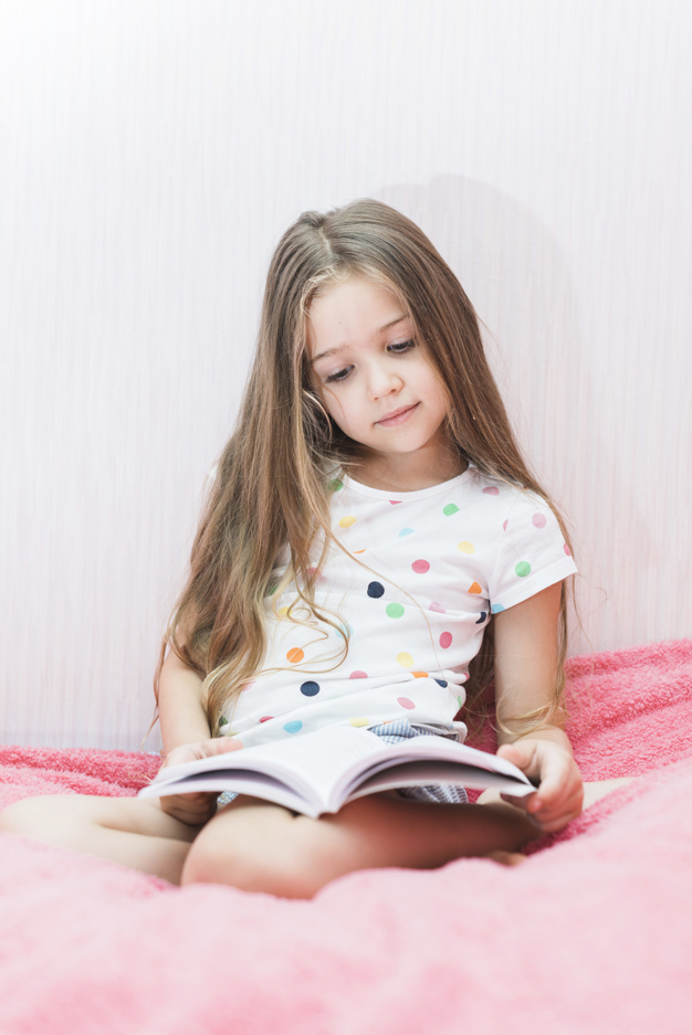 people,book,house,education,hair,home,beauty,pink,cute,kid,child,room,person,learning,dot,bed,living room,reading,bedroom,polka dots