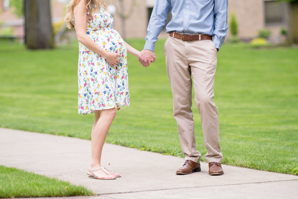 expecting,grass,holding hands,man,pavement,people,pregnant,togetherness,woman