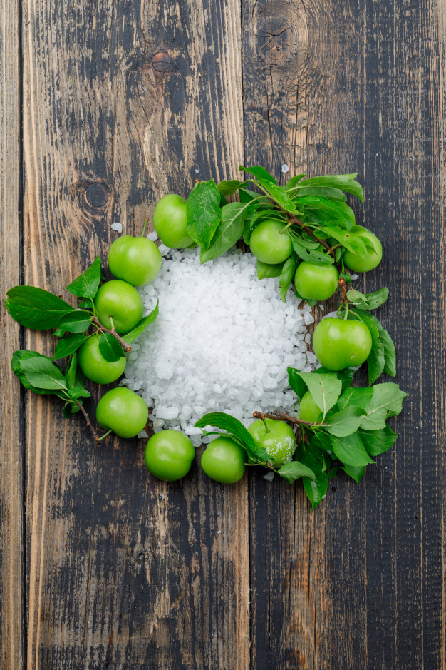 top view of ripe and organic grapes on green Stock Photo by