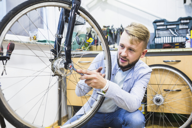 business,people,circle,man,sport,table,shop,bike,human,bicycle,person,business people,store,business man,round,wheel,tire,working,youth