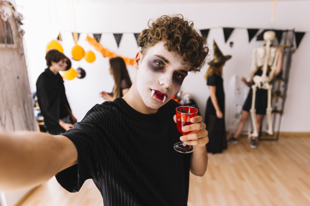 party,halloween,camera,red,autumn,space,celebration,orange,black,decoration,glass,drink,fall,blood,teenager,selfie,zombie,young,witch,skeleton