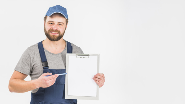 jumpsuit,looking at camera,studio shot,copy space,foreman,laborer,showing,presenting,overall,joyful,brunette,cheerful,repairman,handsome,empty,standing,looking,pointing,copy,smiling,technician,occupation,horizontal,master,shot,handyman,adult,holding,blank,guy,male,clipboard,sheet,paper background,background white,professional,uniform,modern background,studio,engineer,mechanic,cap,service,document,background blue,beard,modern,worker,job,person,pen,white,clothes,happy,white background,space,blue,man,camera,paper,blue background,background