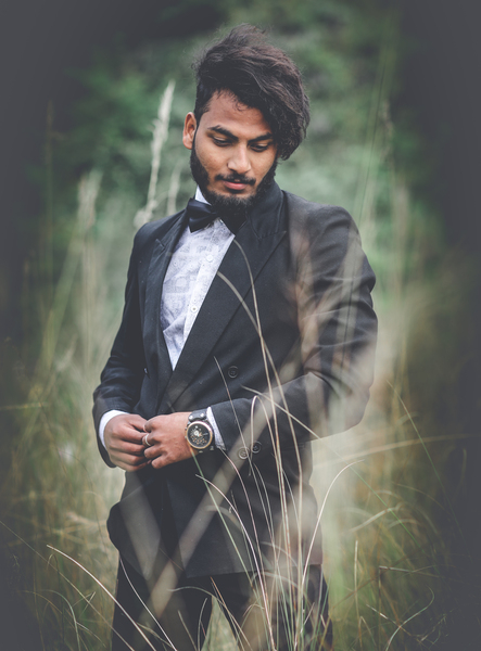 Elegant handsome man in classical suit poses near wooden fence Stock Photo  by ©innervision 116726472