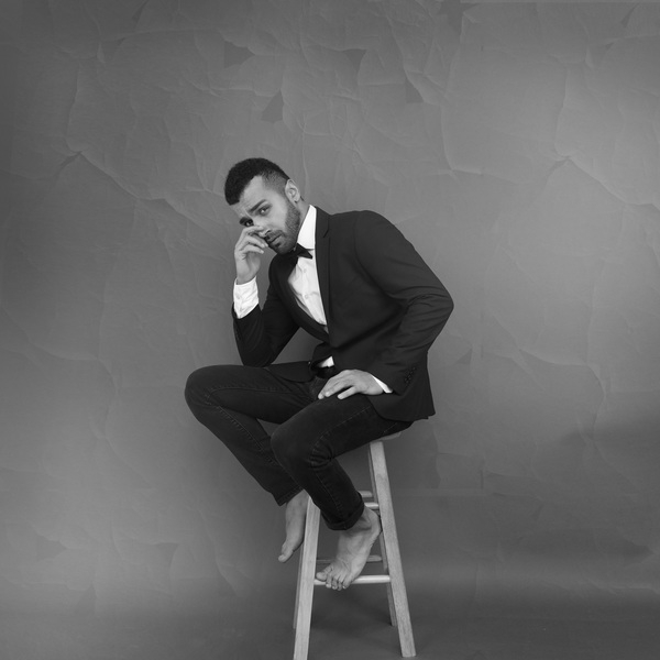 adult,barefoot,black-and-white,bow tie,boy,chair,facial hair,fashion,feet,furniture,guy,indoors,looking,male,man,model,monochrome,photoshoot,pose,posture,seat,sit,sitting,stool,suit,tuxedo,wear,Free Stock Photo