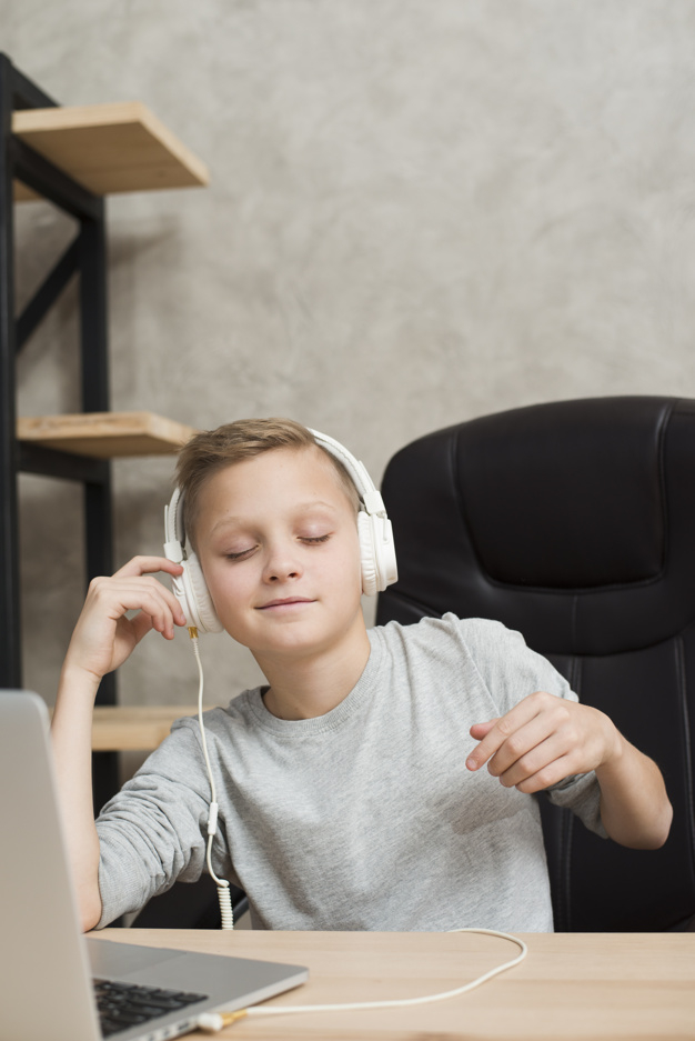 music,technology,computer,office,table,home,laptop,happy,kid,child,boy,desk,modern,sound,fun,pc,headphones,youth,young,office desk