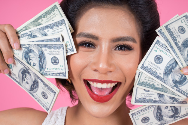 Holding a dollar woman Stock Photo free download