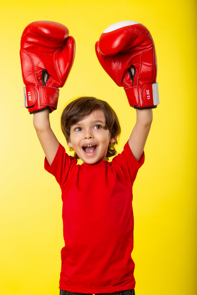 smiling boy,resort area,without,any,front,area,smiling,resort,gloves,boxing,training,exercise,fun,help,boy,child,happy,fitness,sport