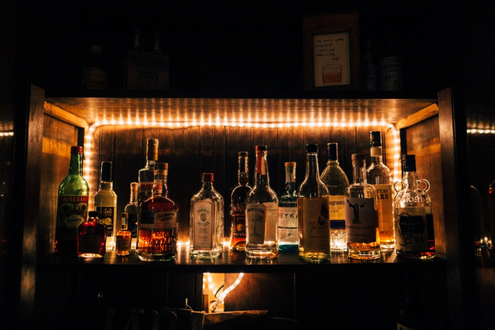 alcohol,alcoholic beverages,bar,beverage,bottles,bourbon,cognac,container,dark,drink,drinks,glass,light,liquid,liquor,pub,restaurant,rum,scotch,still life,stock,whisky,wine