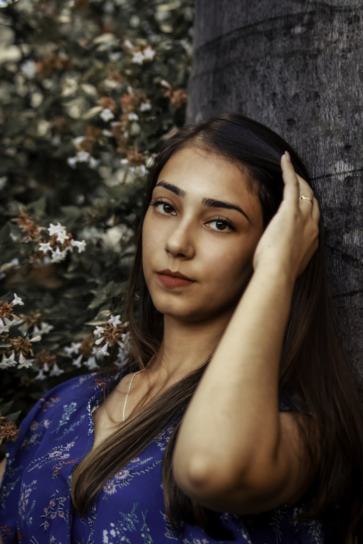 beautiful woman,beauty,brunette,facial expression,female,floral top,hairstyle,looking,model,photo session,photo shoot,pose,posing,pretty woman,tree trunk,woman