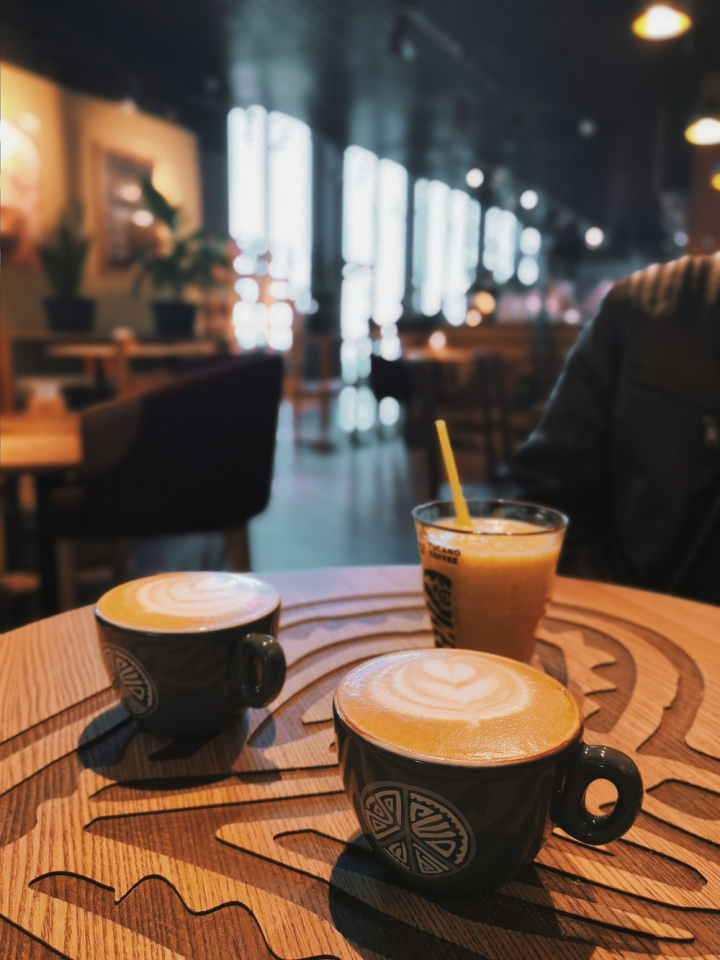 Two Coffee Cups On Wood Table In Cafe Interior Stock Photo