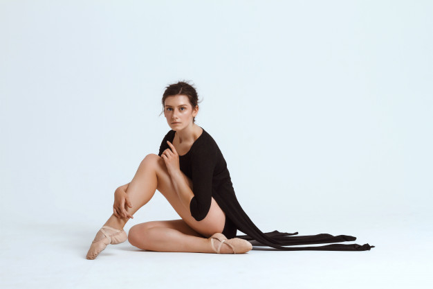 Free: Young beautiful contemporary dancer posing over white wall. copy  space. Free Photo 