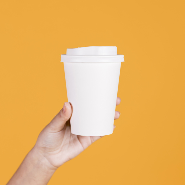 bodypart,caf,closeup,takeout,disposable,coffeecup,showing,caffeine,refreshment,refreshing,takeaway,hold,cappuccino,one,adult,holding,delicious,blank,give,bright,plastic,container,hot,studio,clean,cup,drink,glass,person,backdrop,shape,yellow,white,human,presentation,paper,woman,hand,cover,people,coffee,mockup,background