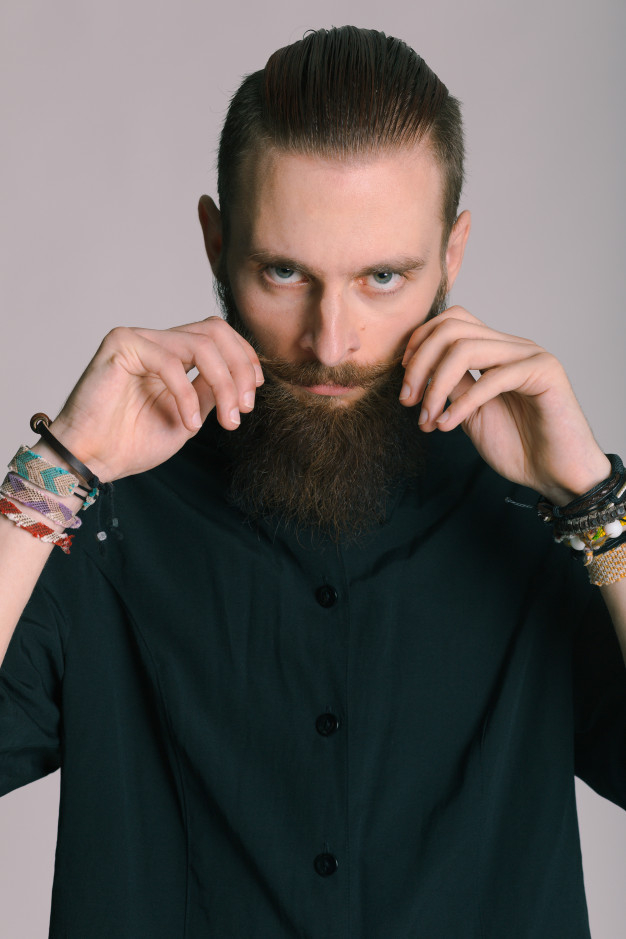 Stylish and comfortable. Man bearded hipster posing confidently in