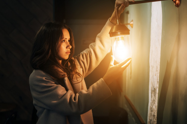 holds,posing,long,small,casual,evening,indoor,standing,glowing,lovely,bright,portrait,lightbulb,beautiful,young,dark,female,electric,lady,model,night,bulb,energy,lamp,person,women,wall,fashion,light,woman,hand