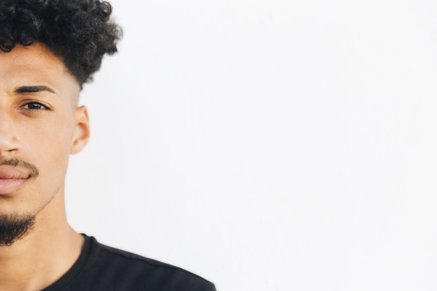 looking at camera,copy space,glance,half face,bearded,relaxed,black hair,contrast,half,sight,african american,crop,looking,copy,stylish,pretty,horizontal,curly hair,curly,male,american,teen,portrait,view,young,african,studio,black and white,teenager,watch,person,white,white background,black,face,space,student,hair,man,camera,background