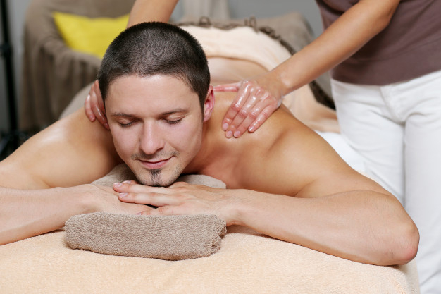 Handsome Man Relaxing and Enjoying a Deep Tissue Back Massage at the Spa  Salon Stock Photo - Image of healthy, holiday: 192876900