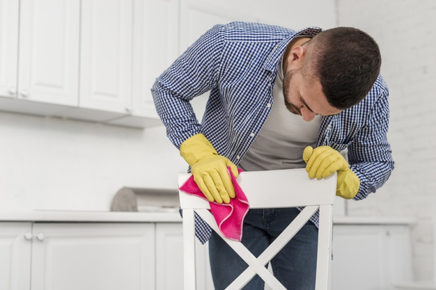 medium shot,errand,front view,domicile,rubber gloves,chore,medium,cleansing,duty,rag,residence,front,rubber,horizontal,household,shot,task,male,gloves,view,washing,chair,cleaning,home,man,house