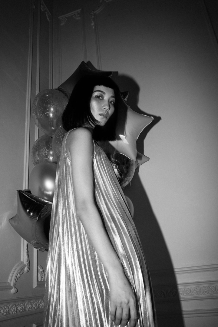 balloons,beautiful,beauty,black and white,black-and-white,facial expression,fashion,female,girl,grayscale,indoors,low angle shot,model,monochrome,monochrome photography,outfit,party,person,photoshoot,portrait,pose,posing,pretty,standing,style,wall,wear,white,white wall,woman