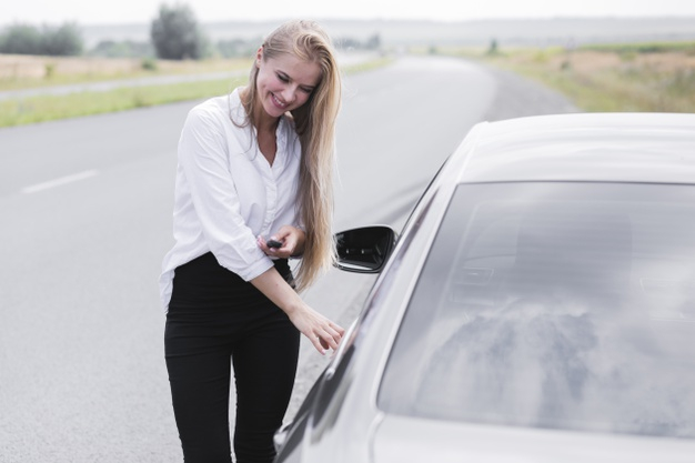 Free: Beautiful woman opening the door of the car Free Photo - nohat.cc