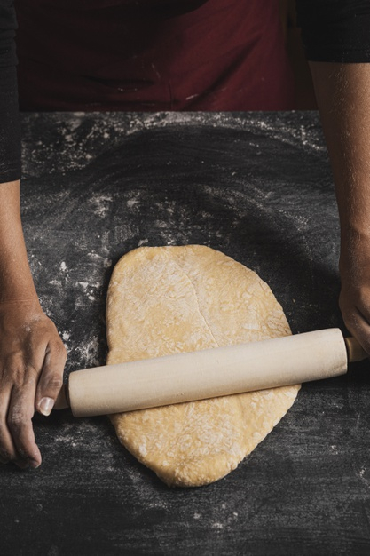 compostion,handmande,rolling dough,kneading,closeup,foodie,rolling,preparation,ingredient,dough,homemade,rolling pin,cuisine,baker,top,view,fresh,nutrition,healthy,product,pin,cooking,kitchen,bakery,hand,food