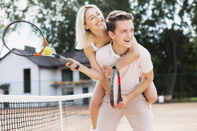 rackets,recreation,racket,outdoors,playing,active,horizontal,adult,match,court,player,fit,day,lifestyle,beautiful,net,young,female,youth,play,exercise,tennis,ball,team,couple,game,sports,happy,girl,sport,man,woman,people