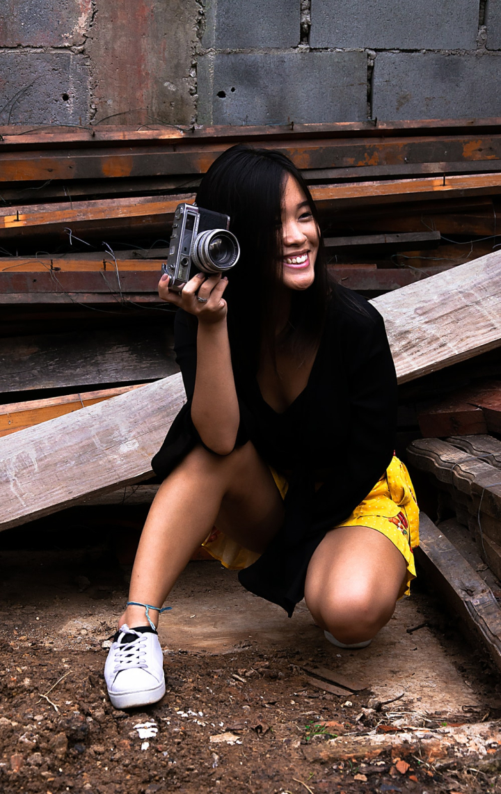 Closeup On Person Holding DSLR Camera In Hands. Top Side View Copy Space  Interior Background Stock Photo, Picture and Royalty Free Image. Image  85803274.