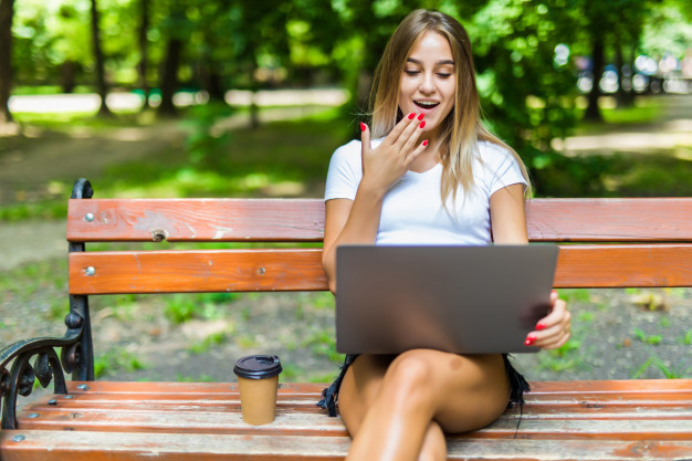 using,disposable,away,caffeine,casual,leisure,outdoors,smiling,adult,go,break,bench,day,sitting,beautiful,young,female,working,pc,reading,finger,park,cup,hat,tablet,drink,person,glasses,happy,laptop,shopping,student,fashion,woman,leaf,computer,book,coffee,tree