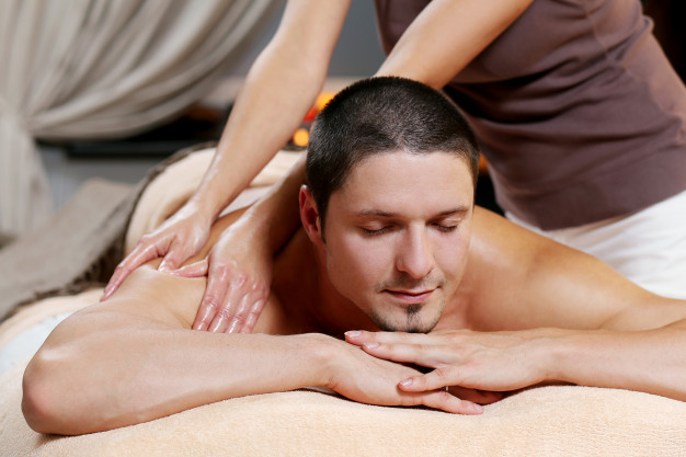 Handsome Man Relaxing and Enjoying a Deep Tissue Back Massage at the Spa  Salon Stock Photo - Image of healthy, holiday: 192876900