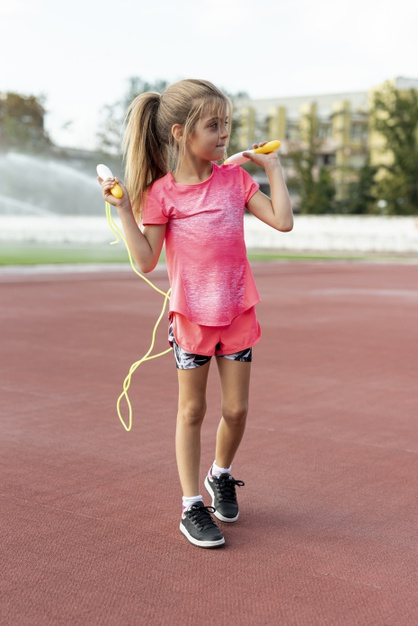 full shot,t,jumprope,front view,little,outside,sporty,full,front,outdoors,shot,view,exercise,healthy,tshirt,child,shirt,kid,cute,health,pink,girl,sport