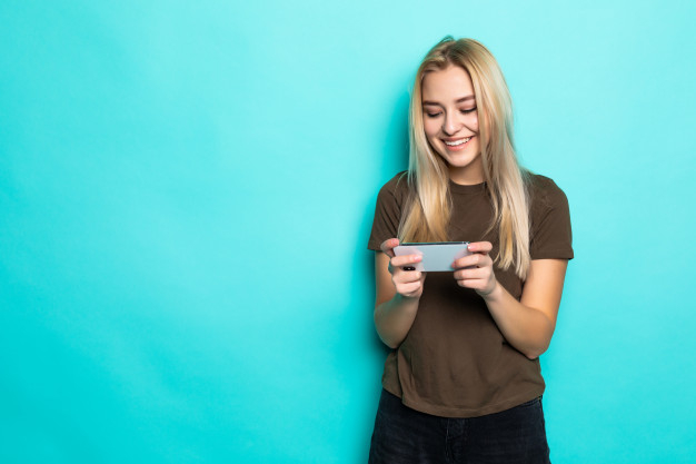 Free: Portrait of an excited pretty girl playing games Free Photo 