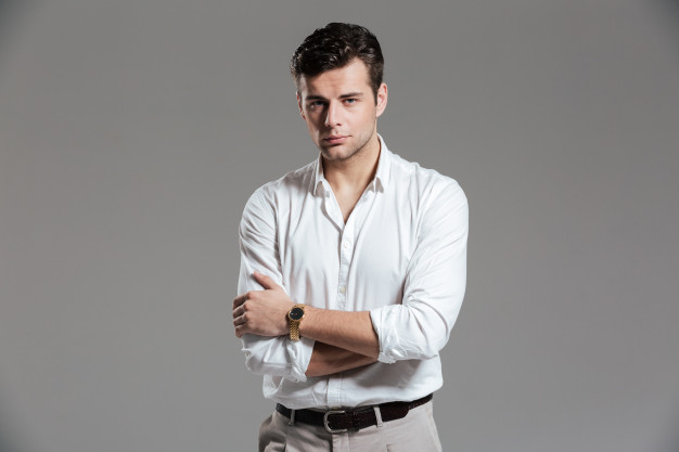 Young Fashion Man Poses with Hand on Shirt Stock Photo - Image of casual,  pose: 33657562