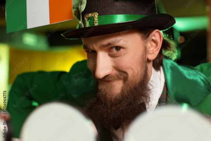 holiday,green,emerald green,costume,shamrock,clover,national,cultural,festive,pub,bar,celebration,celebrate,celebrate,party,evening,leprechaun,hat,man,bearded,dark-haired,long-haired,ales,beer,drinking,drink,glasses,young,generation y,fun,enjoying,naughty,adobestock