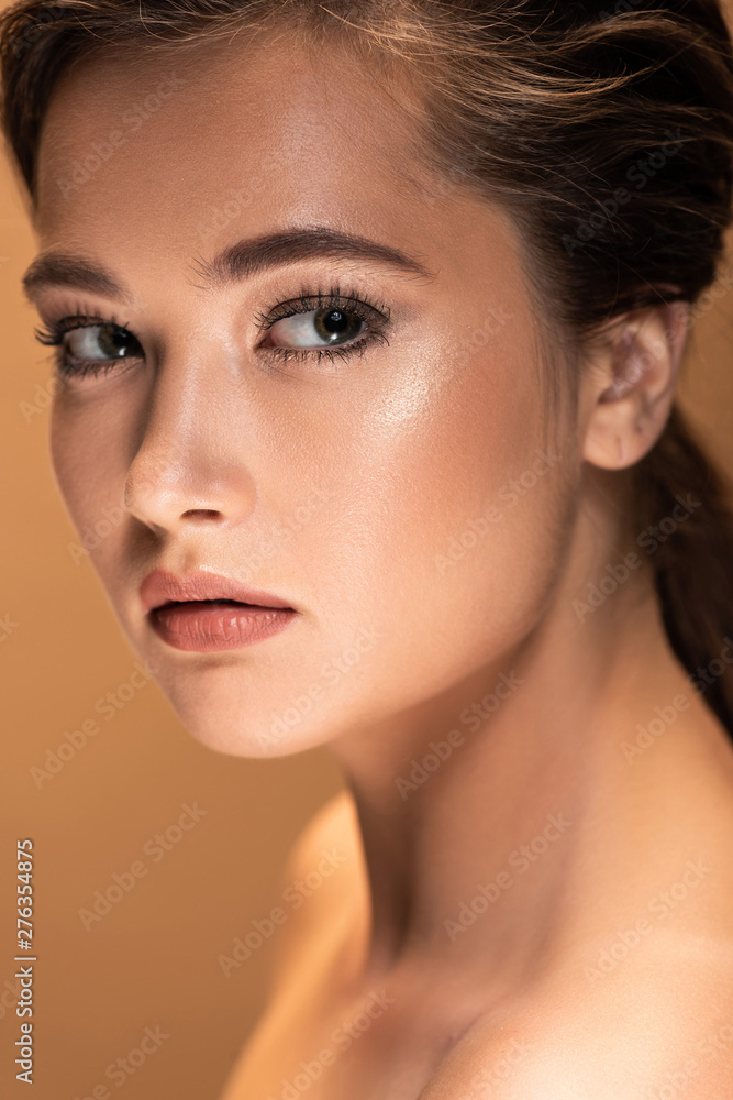 Free: portrait of young beautiful naked woman with shiny makeup isolated on  beige 
