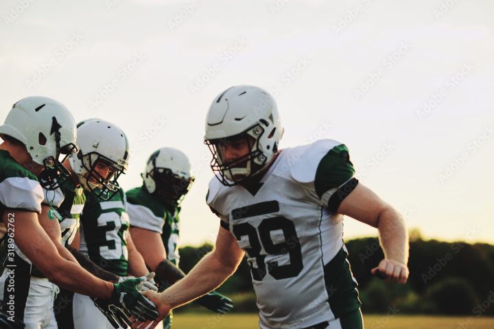 adult,american,athlete,athletic,camaraderie,captain,caucasian,celebrate,competitive,congratulating,copy space,field,football,game,gear,group,guy,high five,male,masculine,match,man,outdoors,outside,people,player,playing,practice,protective,quarterback,smiling,sport,sportsman,sporty,strategy,sunny,team,teammate,together,tough,uniform,victory,white,winner,winning,young,adobestock